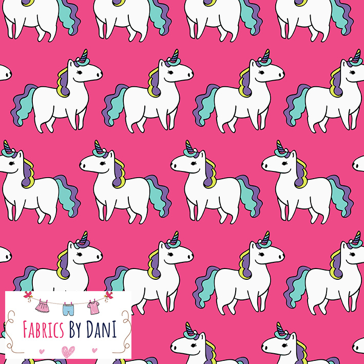 Unicorns on Pink Fabric